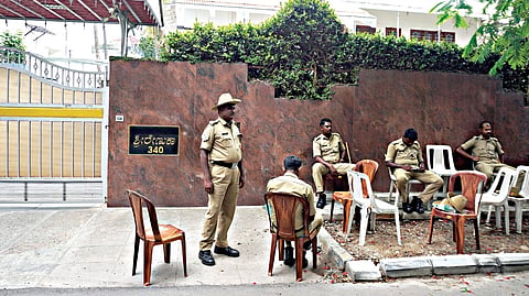 Police outside the residence of BJP leader Kumar Bangarappa following protets by the fans of actor Shivarajkumar, in Bengaluru on Saturday 