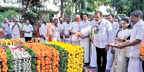 Union Minister Suresh Gopi offers floral tributes at the tomb of K Karunakaran and Kalyanikutty Amma at Punkunnam in Thrissur on Saturday 