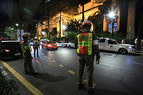 Police officers stand outside the Grand Hyatt Erawan Hotel in Bangkok, Thailand, Tuesday, July 16, 2024.