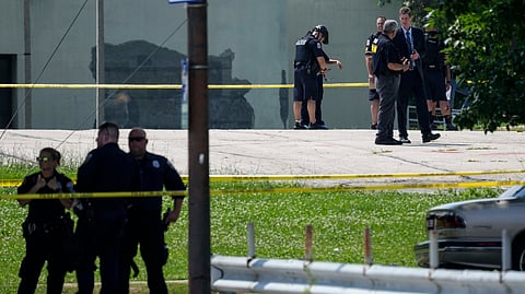 Police investigate a shooting near King Park during the second day of the 2024 Republican National Convention, Tuesday, July 16, 2024, in Milwaukee. 