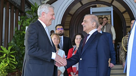 In the photo released by Pakistan's Prime Minister Office, the UN High Commissioner for Refugees Filippo Grandi, left, shakes hand with Pakistan Prime Minister Shehbaz Sharif after their meeting in Islamabad, Pakistan, Tuesday, July 9, 2024.