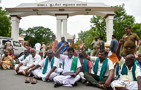 A section of farmers staging a protest in Tiruchy on Monday 