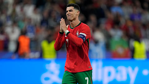Portugal's forward Cristiano Ronaldo reacts after scoring in a penalty shoot-out during the UEFA Euro 2024 round of 16 football match between Portugal and Slovenia at the Frankfurt Arena in Frankfurt am Main on July 1, 2024.