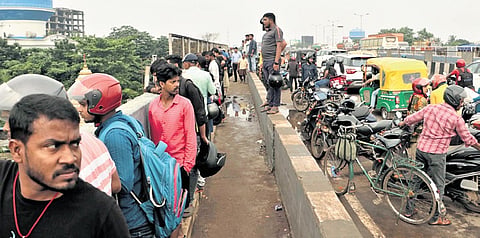 People gather on Rasulgarh flyover to catch a glimpe of the mishap site near Satsang Nagar in Bhubaneswar on Tuesday 