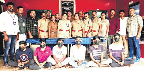 The busted gang of six with police personnel on Tuesday