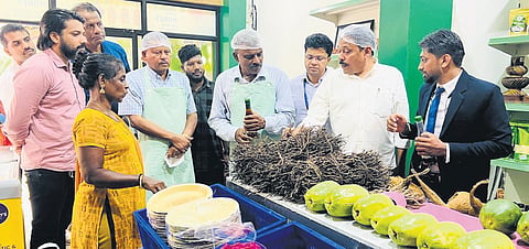 JSS and NABARD officials tasting food items at Engale Cafe in Nilambur