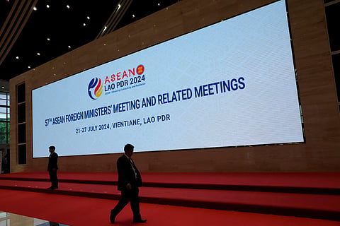 An officer walks in front of a display for the meetings of the Association of Southeast Asian Nations (ASEAN) at the national convention center in Vientiane, Laos, Wednesday, July 24, 2024.