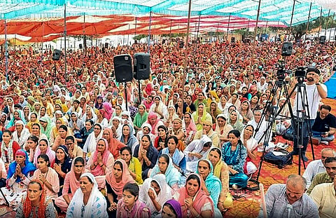  Devotees at the religious gathering where a stampede broke out, in Hathras district, Tuesday, July 2, 2024. At least 27 people were killed and several injured in the stampede, according to officials. 
