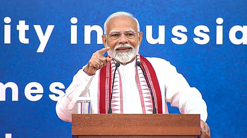 Prime Minister Narendra Modi addresses the Indian community in Russia during a programme, in Moscow.