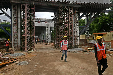 Hyderabad - Construction labourer working near a under construction flyover in Hyderabad  