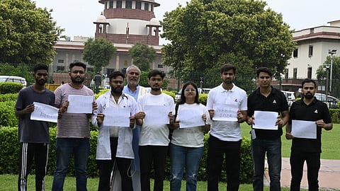 Students at Supreme Court during the hearing of alleged NEET paper leak case in New Delhi on Thursday. 