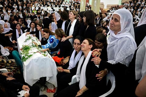Druze women mourn by a coffin during a funeral of a person killed in a rocket strike from Lebanon a day earlier, that Israeli authorities said killed 12 people including children in the Druze town of Majdal Shams in the Israel-annexed Golan Heights, on July 28, 2024.