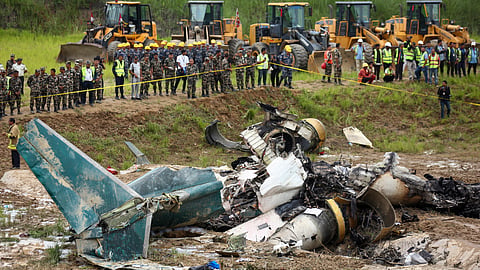 Nepal army personnel cordon off a plane crash site at Tribhuvan International Airport in Kathmandu, Nepal, Wednesday, July 24, 2024. 
