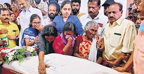 Melhi weeps inconsolably as she sits beside the body of her son Joy at the house of the latter’s brother at Marayamuttom in Thiruvananthapuram on Monday. Mayor Arya Rajendran is also seen