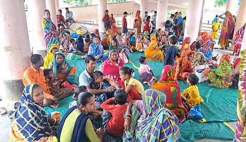 Displaced people at a cyclone shelter away from the missile test range. 