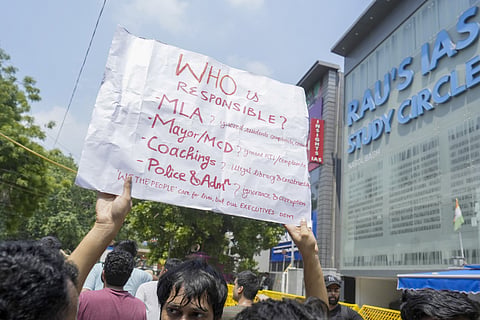  A student during a protest after three civil services aspirants died due to drowning at a coaching centre in Old Rajinder Nagar area, in New Delhi, Monday, July 29, 2024.