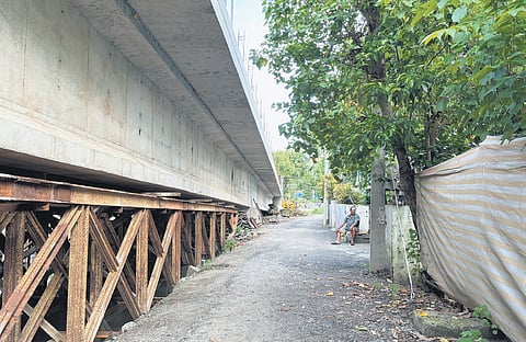 The underpass of the under-construction Kadamakkudy-Chathanad bridge  that has been closed, leaving the residents in lurch as they are unable to get to the other side of the road
 
