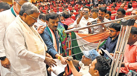 Chief Minister Siddaramaiah interacts with Congress workers at the KPCC office 
in Bengaluru on Saturday   