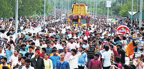 Devotees take part in Giri Pradakshina at Simhachalam in Vizag 