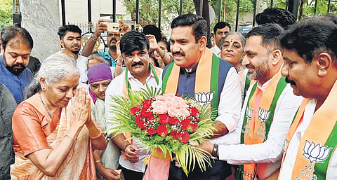 BJP state chief BY Vijayendra and party workers welcome Union Finance Minister Nirmala Sitharaman to the party office in Bengaluru on Sunday 