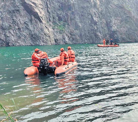 Rescue teams scanning the quarry at Tapang 