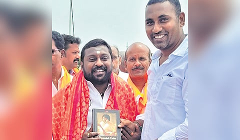 BJP cadre greeting SG Suryah 