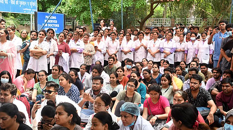 Resident doctors and nurses during their indefinite protest at the GTB hospital against the hospital administration after a patient was shot dead inside the hospital ward, demanding improvement in the security situation, in New Delhi on Tuesday. 