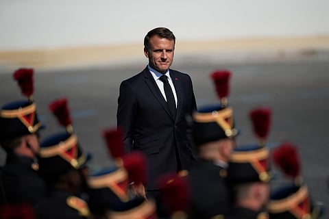 French President Emmanuel Macron reviews the Republican Guards during the Bastille Day parade Sunday, July 14, 2024 in Paris. 