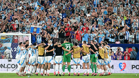 Argentina's players celebrate their team's victory in the Conmebol 2024 Copa America tournament semi-final football match between Argentina and Canada on July 9, 2024.