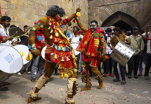 A devotee dressed as Potharaju performs during the 'Ashada Bonalu'' festival, at the Golconda Fort, in Hyderabad, Sunday, July 7, 2024.