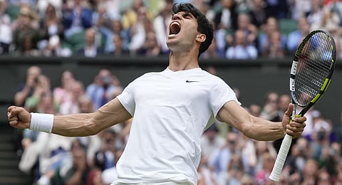 Carlos Alcaraz of Spain celebrates after defeating Daniil Medvedev of Russia in their semifinal match at the Wimbledon tennis championships in London, Friday, July 12, 2024.