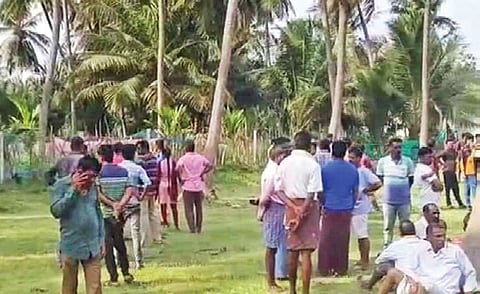 Villagers gathered at the spot where the accused’s body was found 