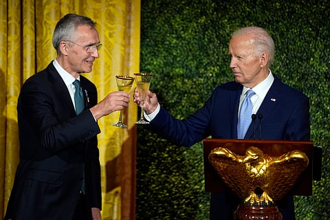 President Joe Biden toasts with NATO Secretary General Jens Stoltenberg during a social dinner in the East Room for NATO allies and partners at the White House in Washington, Wednesday, July 10, 2024. 