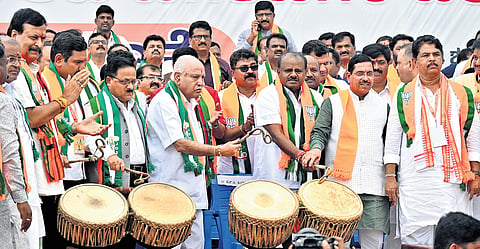 Senior BJP leader BS Yediyurappa with Union Ministers HD Kumaraswamy and Pralhad Joshi