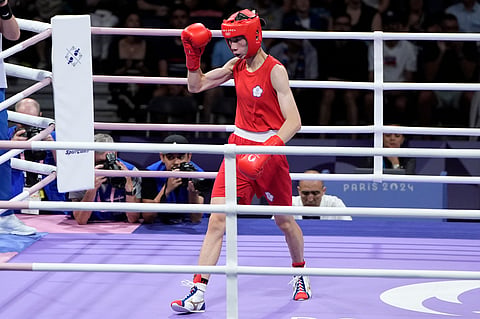 Taiwan's Lin Yu-ting motions between rounds against Bulgaria's Svetlana Staneva in their women's 57 kg quarterfinal boxing match at the 2024 Summer Olympics.