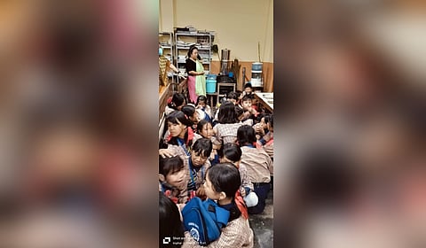 Children at a nearby school squatting on the floor of their classroom as the police kept firing the tear gas shells.