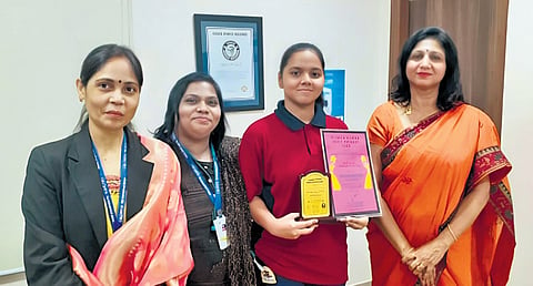 The Principal and staff of Orchids The International School presents Siddhita (second from right) with Girl Child Prodigy Award for the Bloom Riddhi Siddhi app.