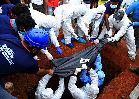 Mass burial of the unidentified bodies of landslide victims at  the mass burial ground at Puthumala tea estate. 