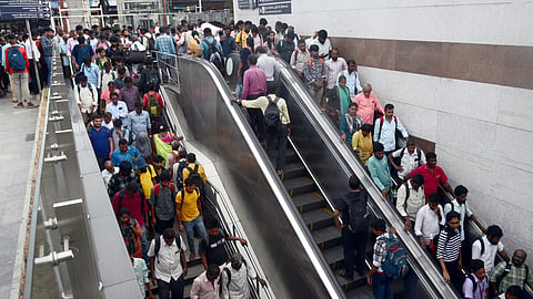 Large number of commuters coming out from Park railway station.