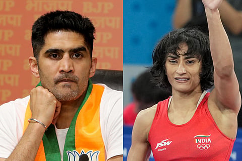 Indian boxing stalwart Vijender Singh (L)  Olympian Vinesh Phogat
