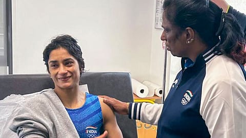 IOA President PT Usha with Vinesh Phogat following her disqualification.
