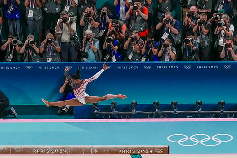 Simone Biles, of United States, performs on the beam during the women's artistic gymnastics team finals at the 2024 Summer Olympics, Tuesday, July 30, 2024, in Paris, France. 