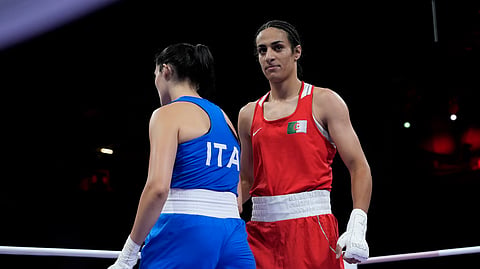Algeria's Imane Khelif (R) walks beside Italy's Angela Carini after their women's 66kg preliminary bout at the 2024 Summer Olympics, on August 1, 2024, in Paris, France.