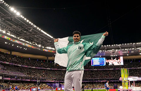 Pakistan's Arshad Nadeem celebrates after winning the gold medal in the men's javelin throw athletics event at the 2024 Summer Olympics, in Paris, France, Thursday, Aug. 8, 2024. 