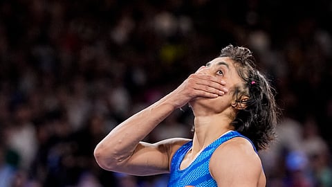 India's Vinesh Phogat reacts after the round of 16 of the women's freestyle 50kg wrestling match against Japan's Yui Susaki, at Champ-de-Mars Arena, during the 2024 Summer Olympics, Tuesday, Aug. 6, 2024, in Paris, France.