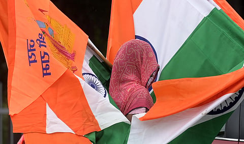 A vendor sells National flag  in New Delhi.