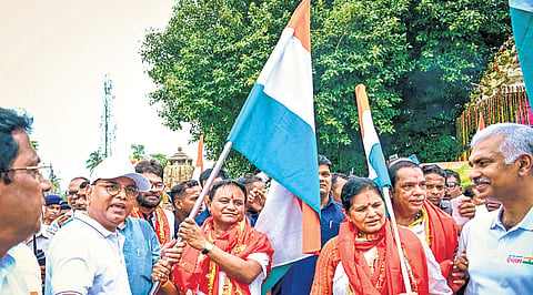 CM Mohan Majhi waving the Tricolour at Old Town in Bhubaneswar on Wednesday. Also seen are Dy CM Pravati Parida,chief secretary Manoj Ahuja and BJP leaders 