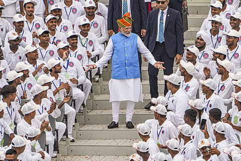Prime Minister Narendra Modi greets children at the Red Fort on 78th Independence Day, in New Delhi, Thursday, Aug. 15, 2024. 