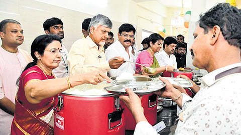 CM Nara Chandrababu Naidu along with his wife Bhuvaneswari seen serving food 
to the people at Anna Canteen in Gudivada on Thursday
