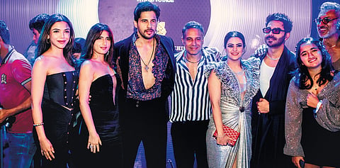 Celebrity attendees with Sidharth Malhotra (centre), Shantnu (fourth from left), and Nikhil (extreme right) 
